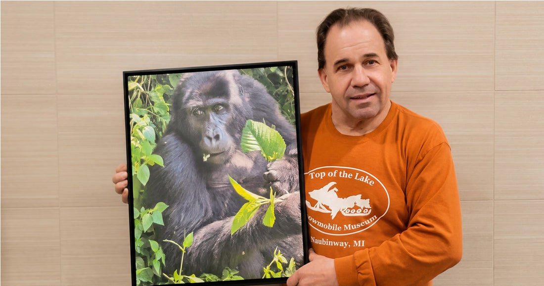 David Ford, co-founder, holding a 16x20 Wowzart print of a Gorilla